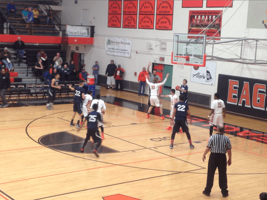 Noah Christy defends the pass in the Eagles end in the second game of the Alaska Airlines Classic