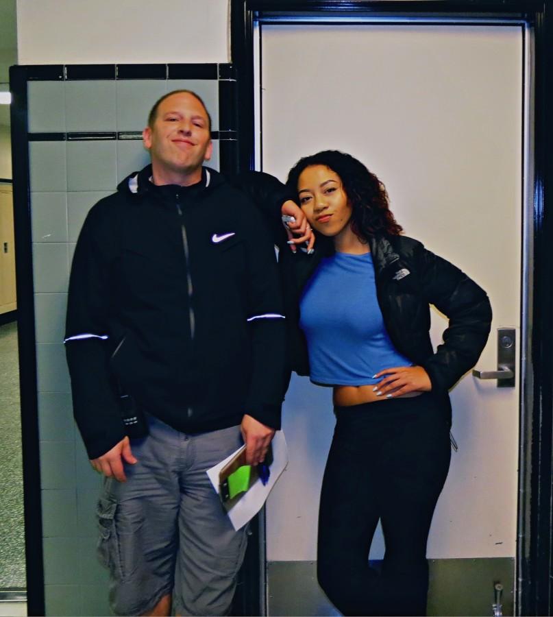 Asia Pouncy and Security Guard Charlie Engel discuss the dress code. 