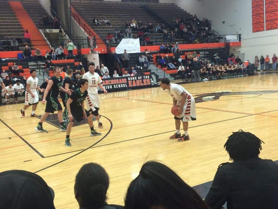 Basketball boys West vs. Colony. The score was 82-70. The game took place at West High School gymnasium at 7:45 Pm. This game was part of the tournament and the West won by 12 points and made it to the Semi-Final. In the pic Eagless from West have the ball and he is trying to pass the ball to his team mate Shawn.  
