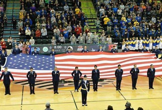 West High AFJROTC Cadets present the Big Flag at the 3rd Girls State Championship Game March 26th.