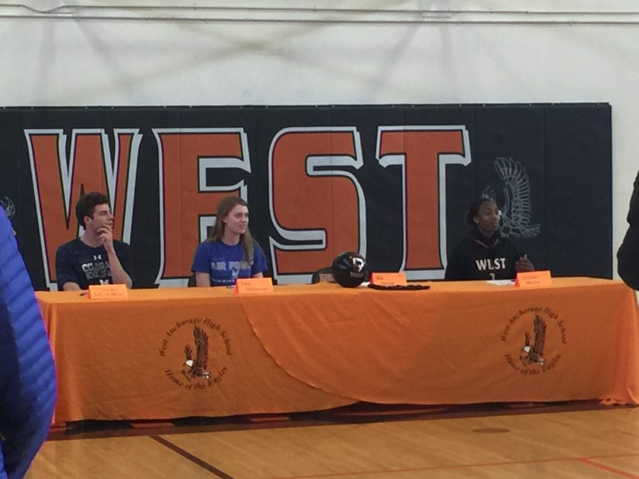 Greyson Adams, Tara DiGeorge, and Dazhon Wyche talk at the NLIT Signing on Thursday, April 28.