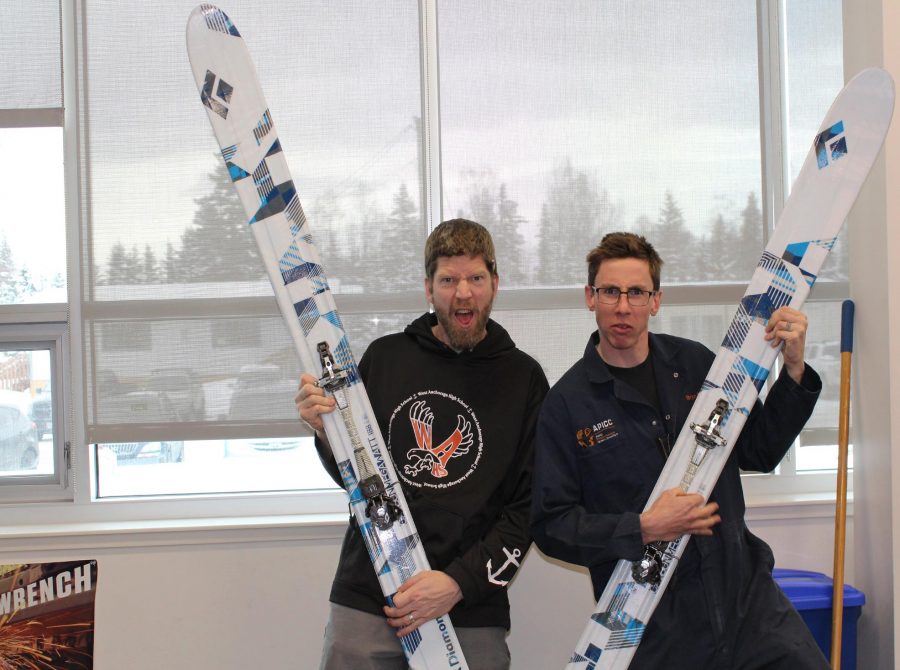 The two West High teachers, Berglund and Friedrichs, show off their skis.