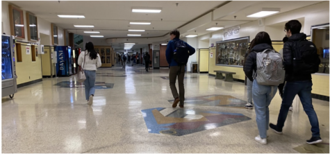 Tardy students walk through the foyer after arriving to school. 