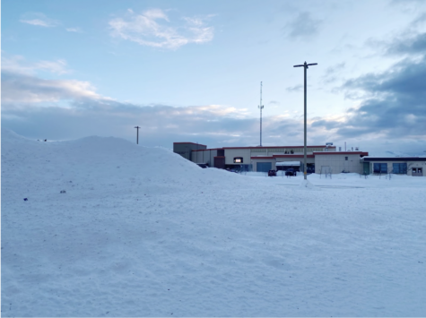 A giant mountain of snow sits in the West parking lot, a result of the nearly four feet of snow accumulated in December. 